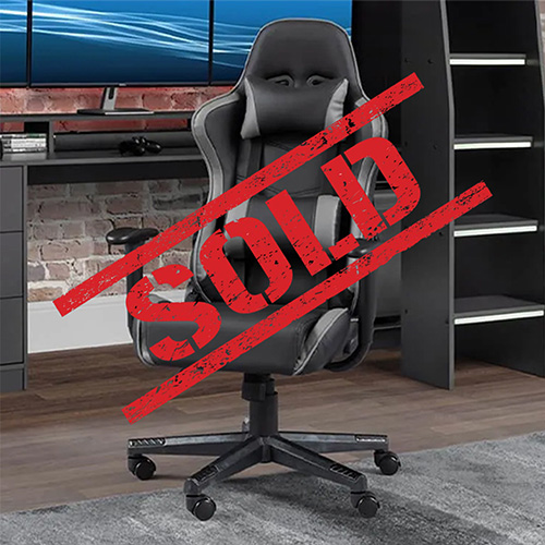 Ergonomic gaming chair with high backrest, adjustable armrests, and lumbar support, positioned in a gaming setup.