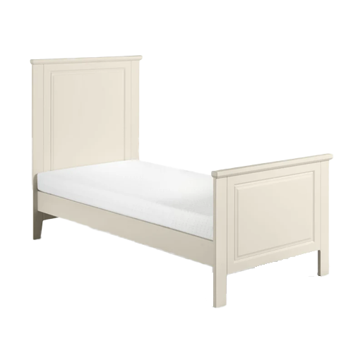 Cameo Cotbed in white, showing adjustable side rails and mattress base, positioned in a modern nursery.
