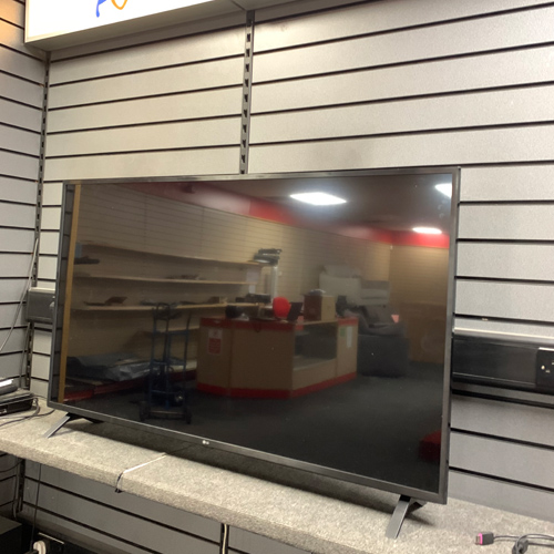 LG UN73 55 inch 4K Ultra HD Smart TV with minimalist stand and slim bezel design