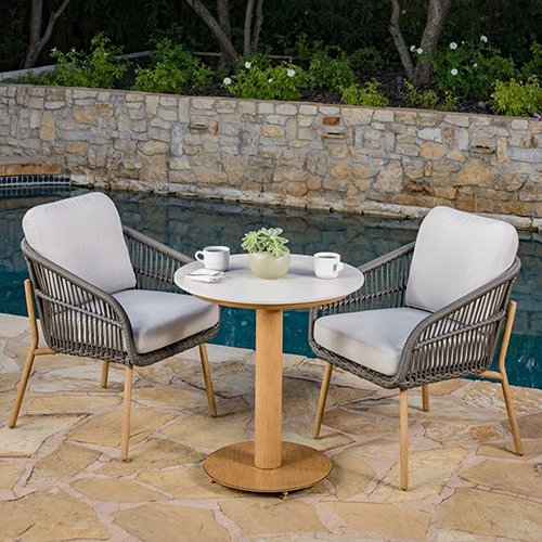 Charme 3-piece outdoor dining set with wicker chairs and round stone table